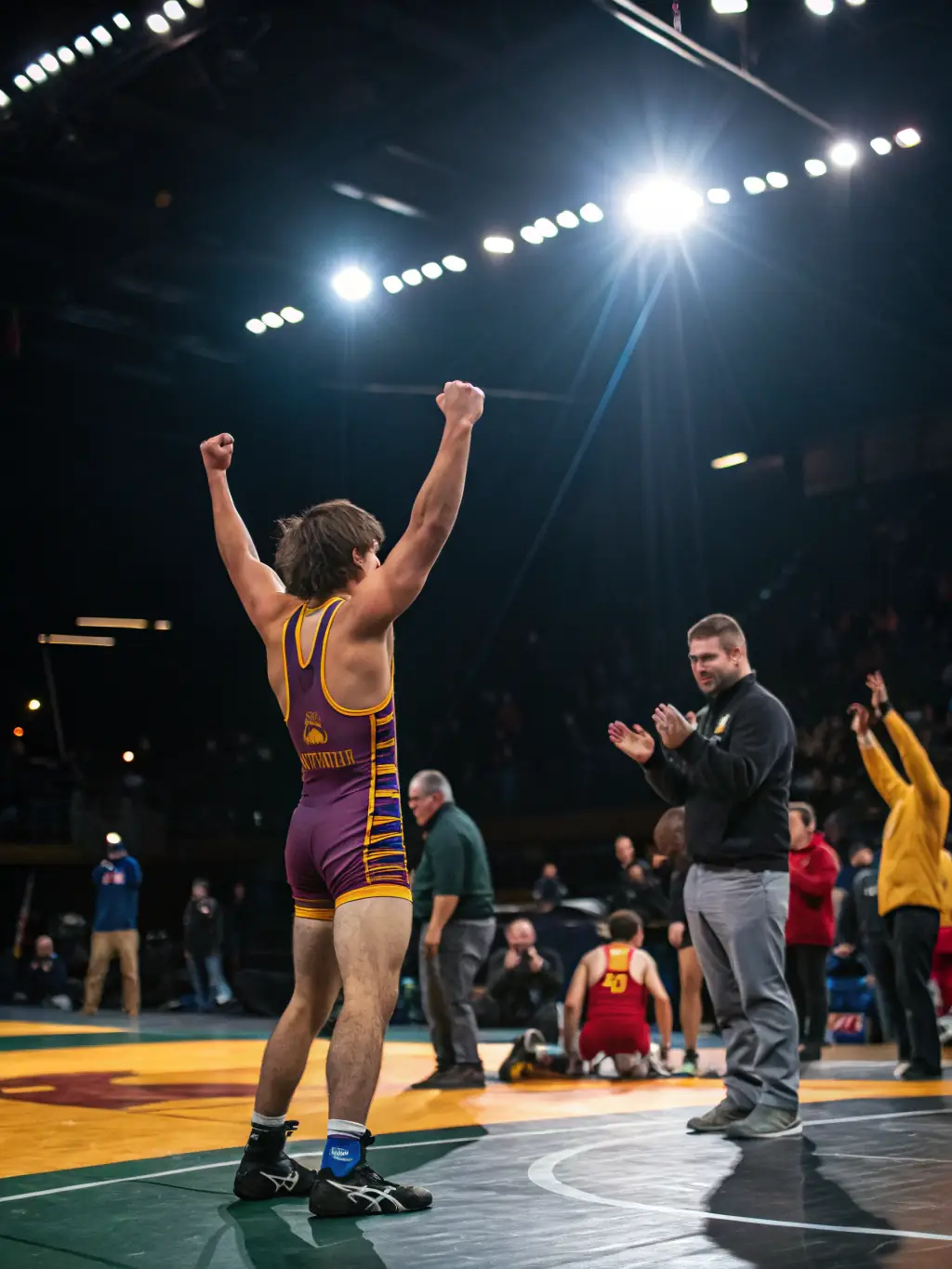 A photo of participants celebrating after an arm wrestling event, emphasizing the camaraderie and sportsmanship within the organization.